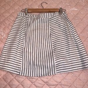 Cooperative Brand white skirt with blue stripes.